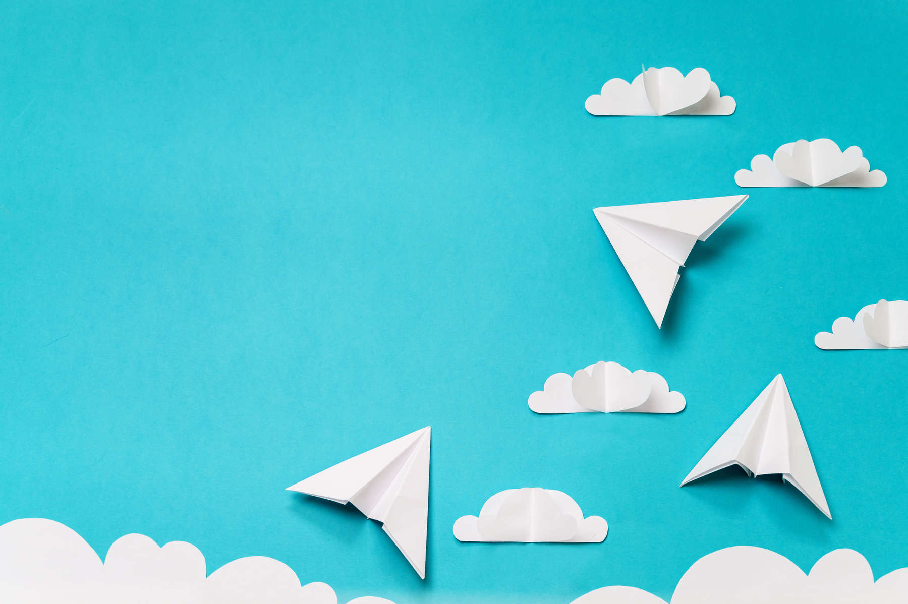 Paper cut clouds and origami planes. Creative concept for banner/landing/background designs.