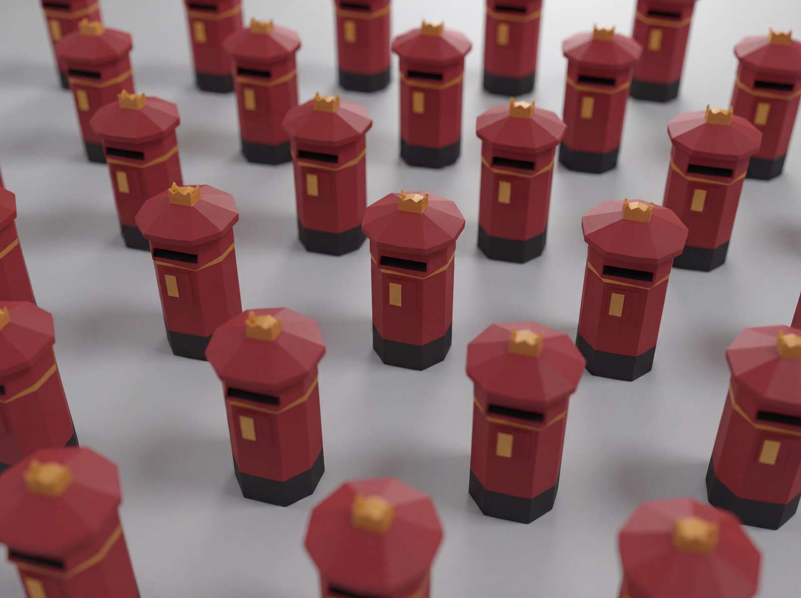 Papercraft - red UK postboxes in a repeated pattern on a light grey background